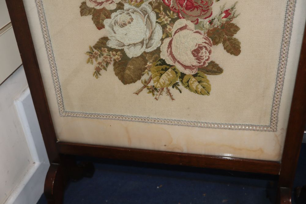 A petit point fire screen and a silkwork floral embroidered firescreen